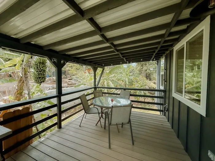 Covered lanai with seating at the Island Style Surf Camp